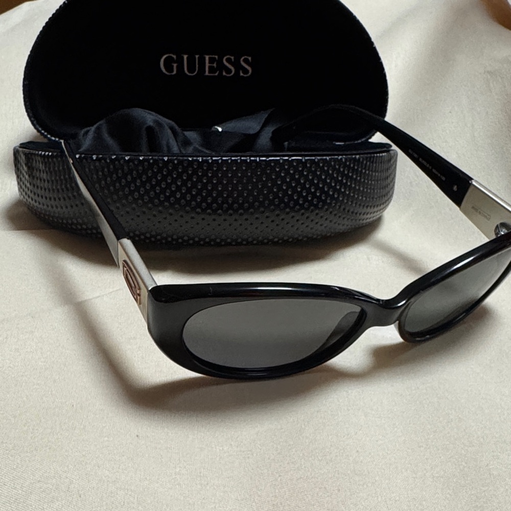 Guess Black and Silver Sunglasses with polarized lenses.
